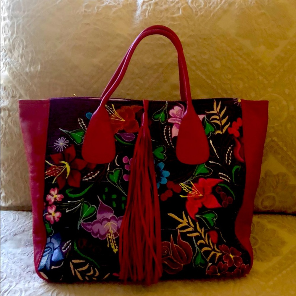 Hand embroidered leather trim and tassel tote.